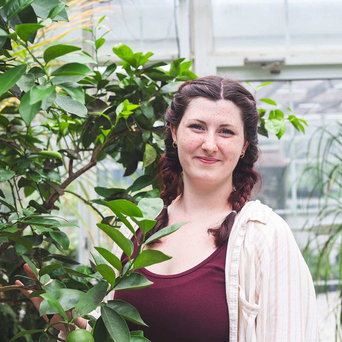 Olivia-woman-headshot-greenhouse