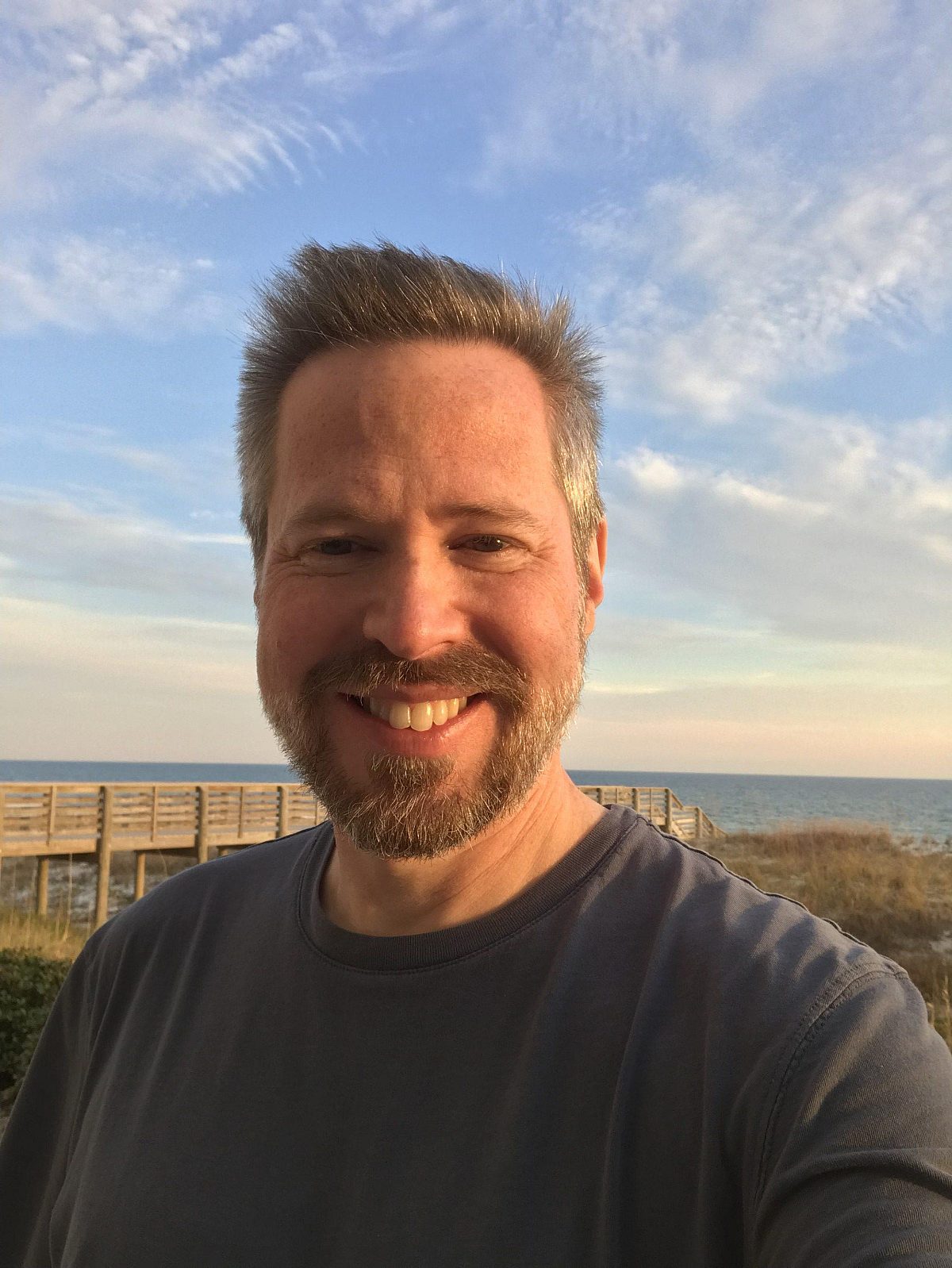 man standing in front of beach