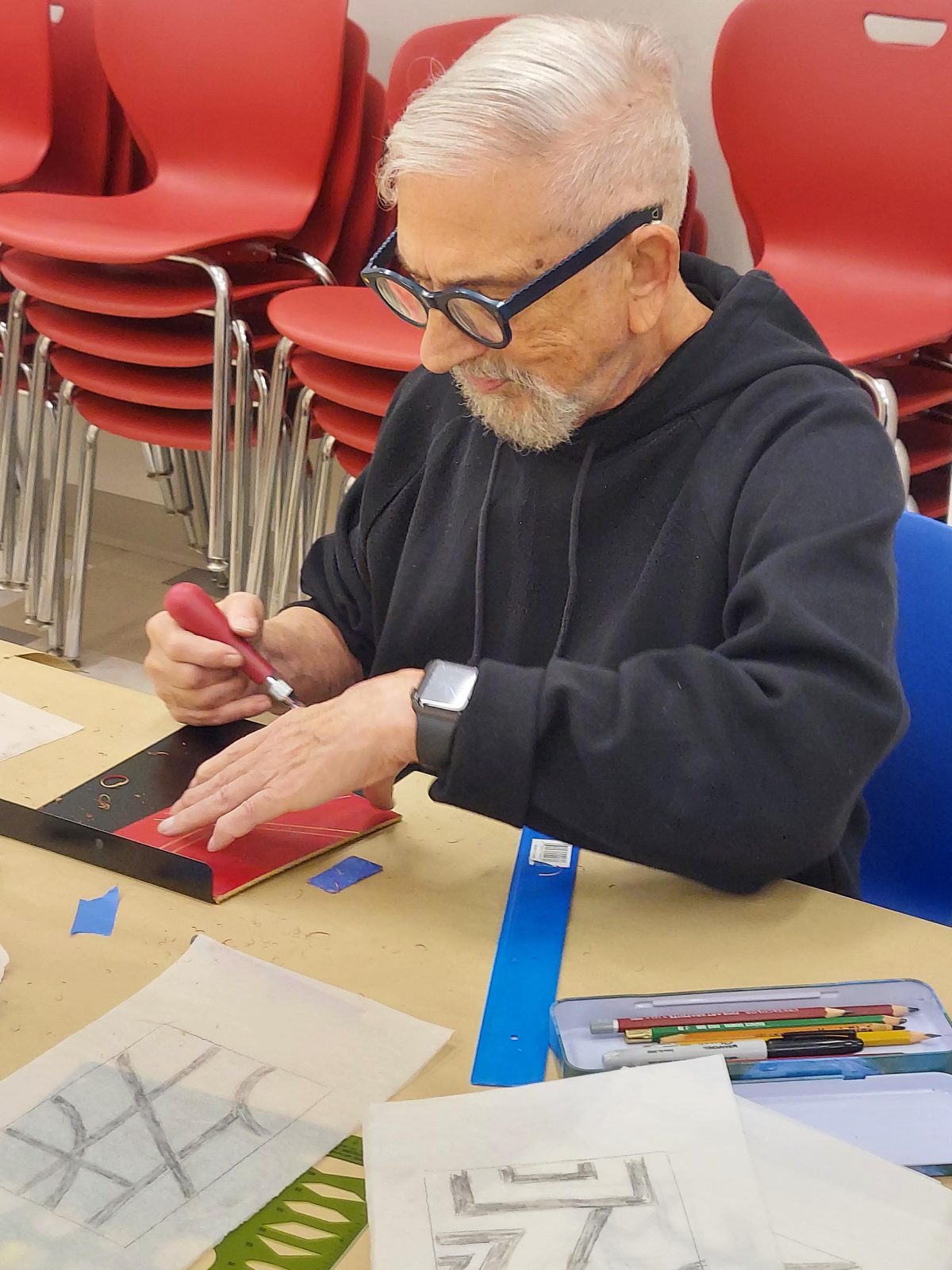 older man putting together project