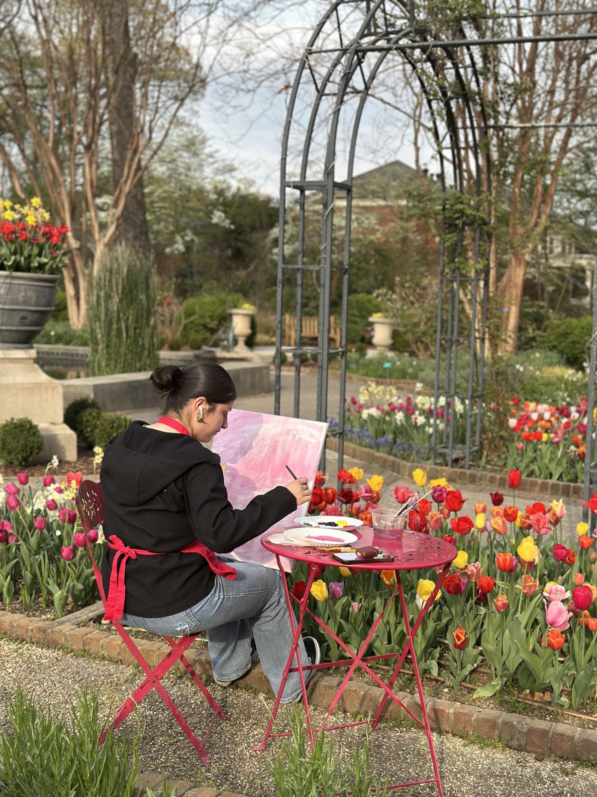 a photo of a workshop participant painting in the cutting gardens