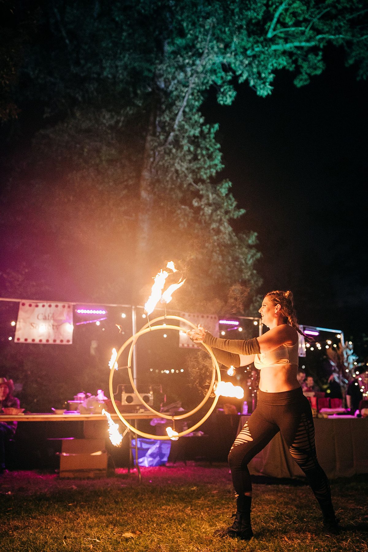 Art on Fire Entertainer Spinning hula hoops that are on fire