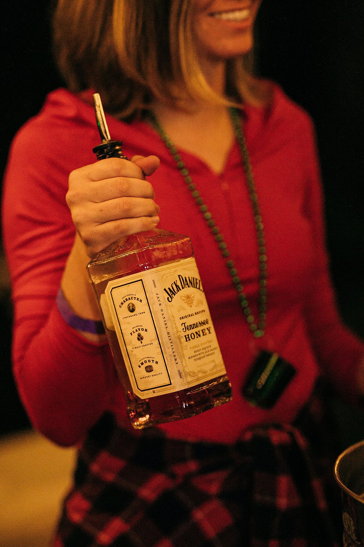 Art on Fire bartender holding a bottle of Jack Daniels Fire