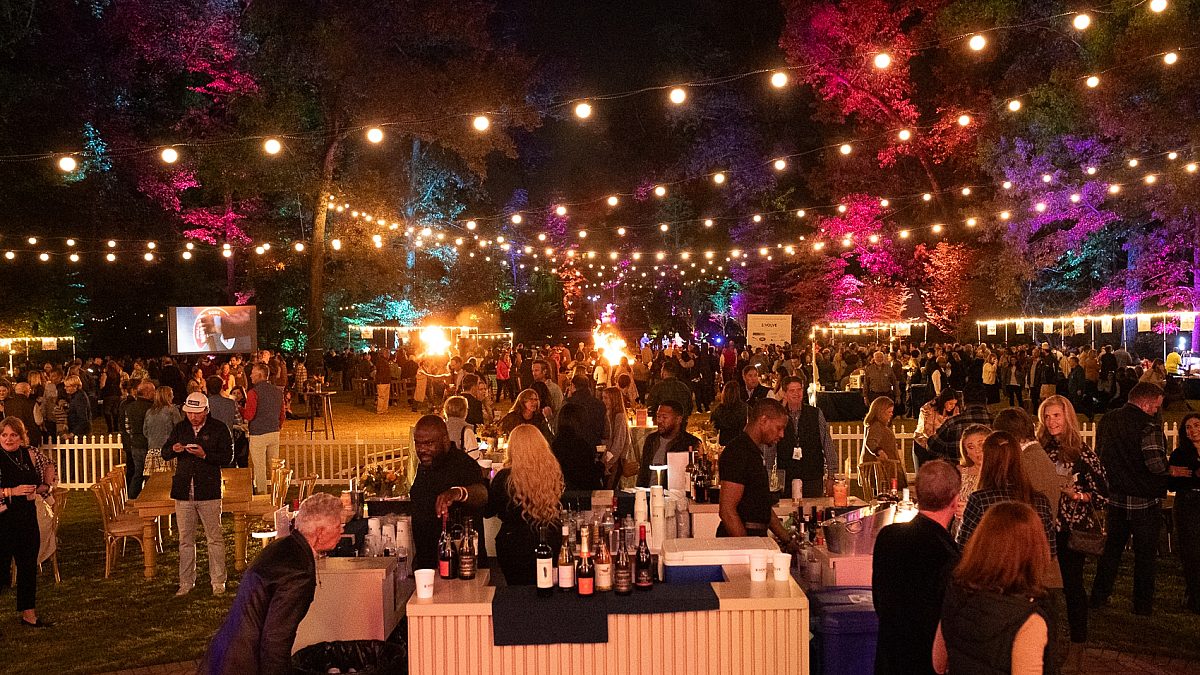 people enjoying food and drinks at art on fire