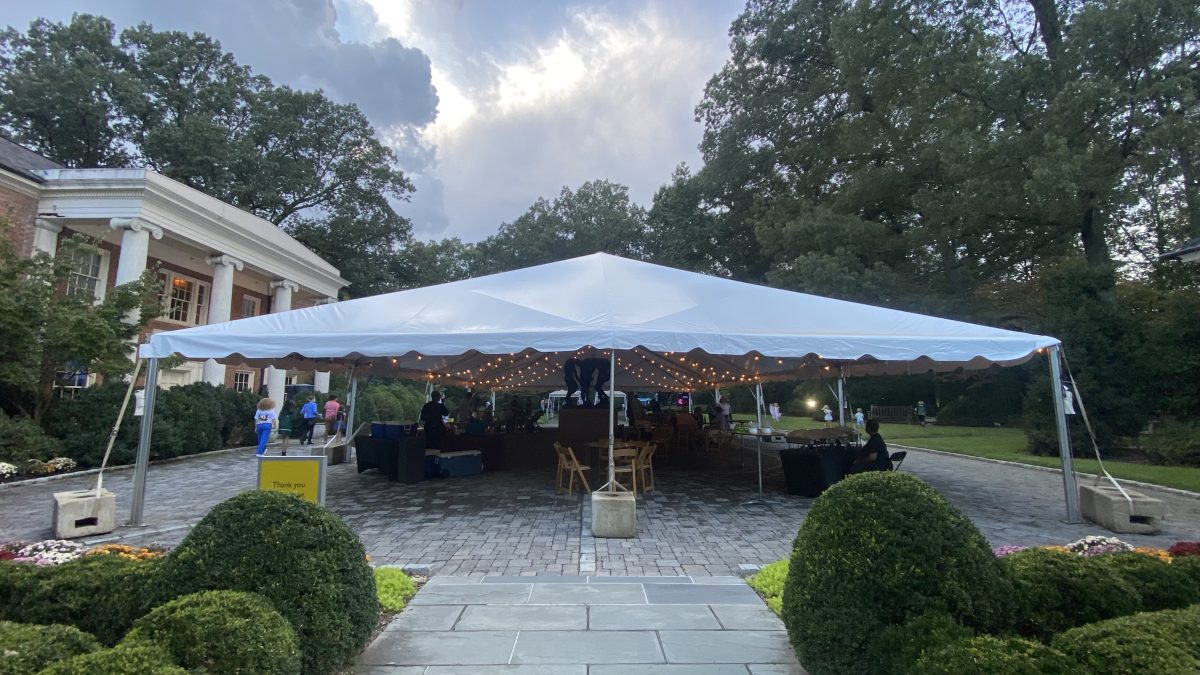 large white event tent spread out over central museum pavilion