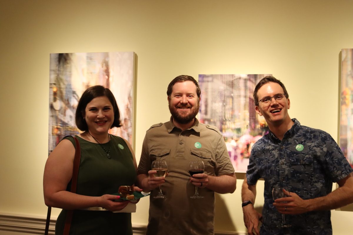 Opening Reception Photo of Members Drinking Wine and having fun
