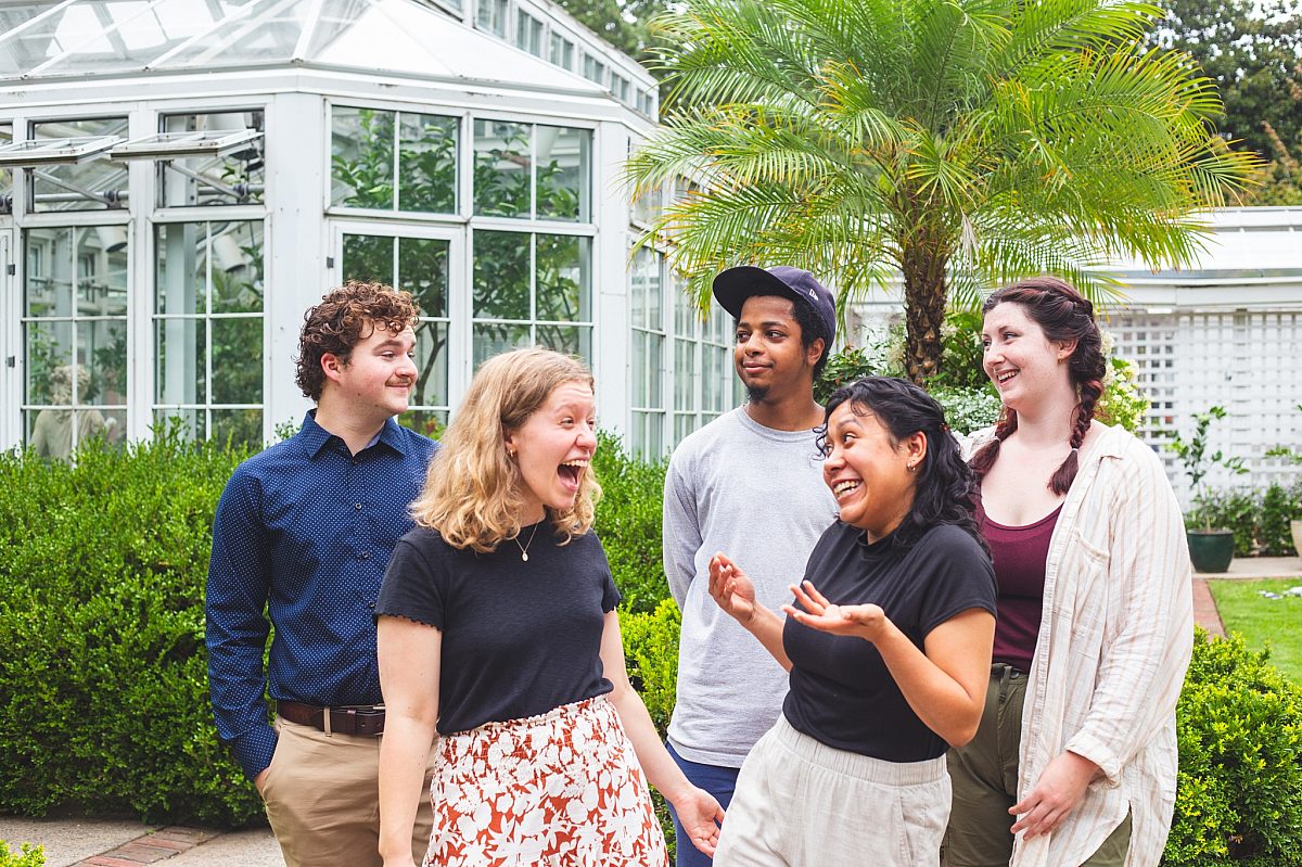 Interns-group-smiling headshots-garden-greenhouse