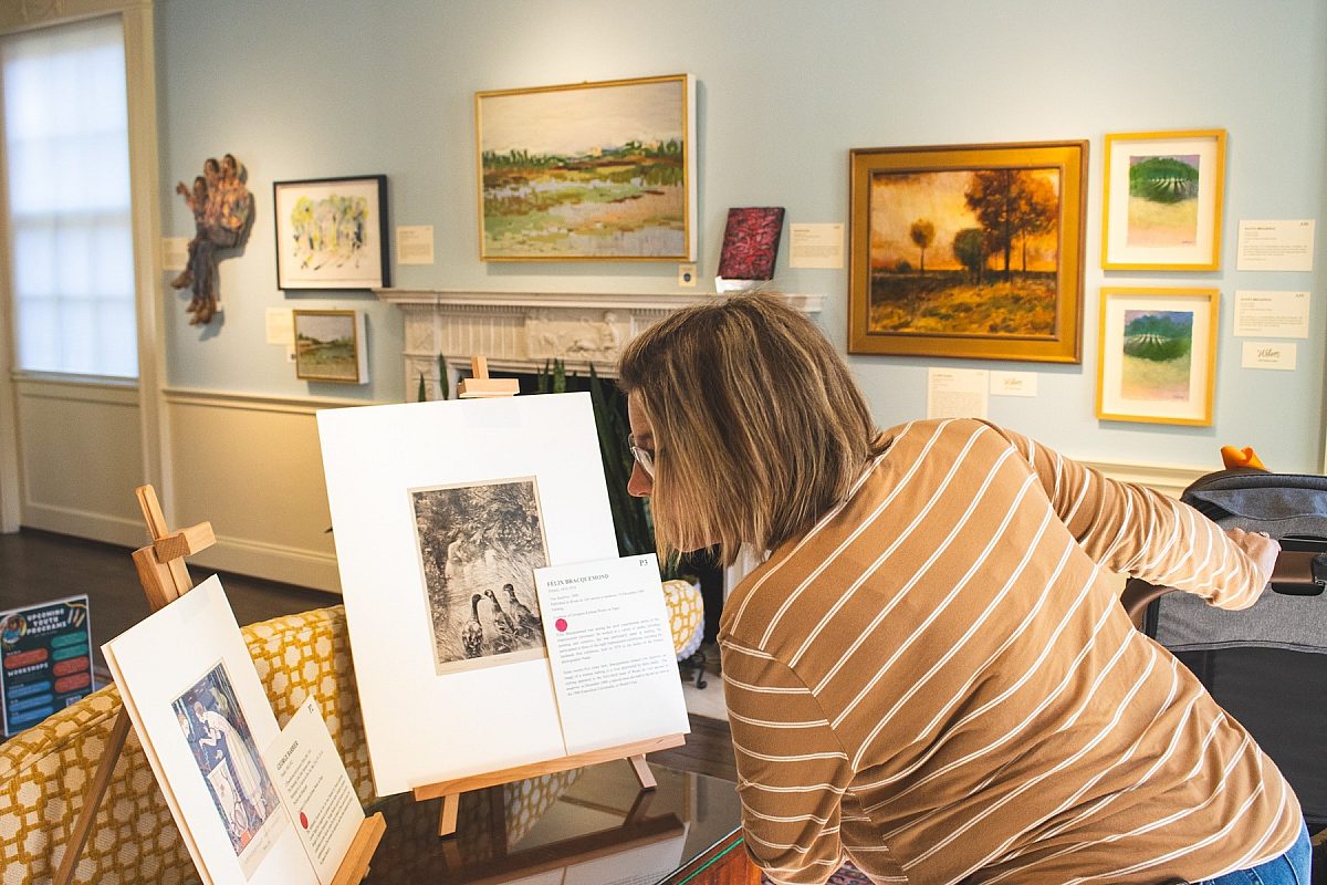 Hot off the wall art sale woman shopping