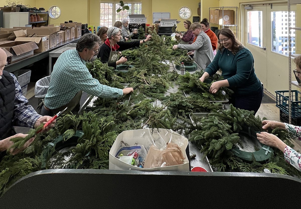 Workshop participants making holiday or winter Wreaths
