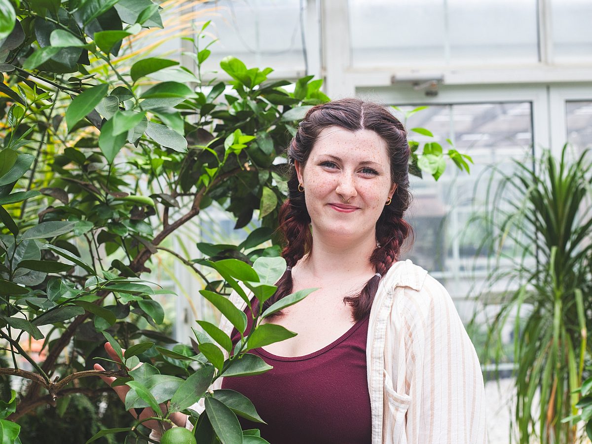 Olivia-woman-headshot-greenhouse