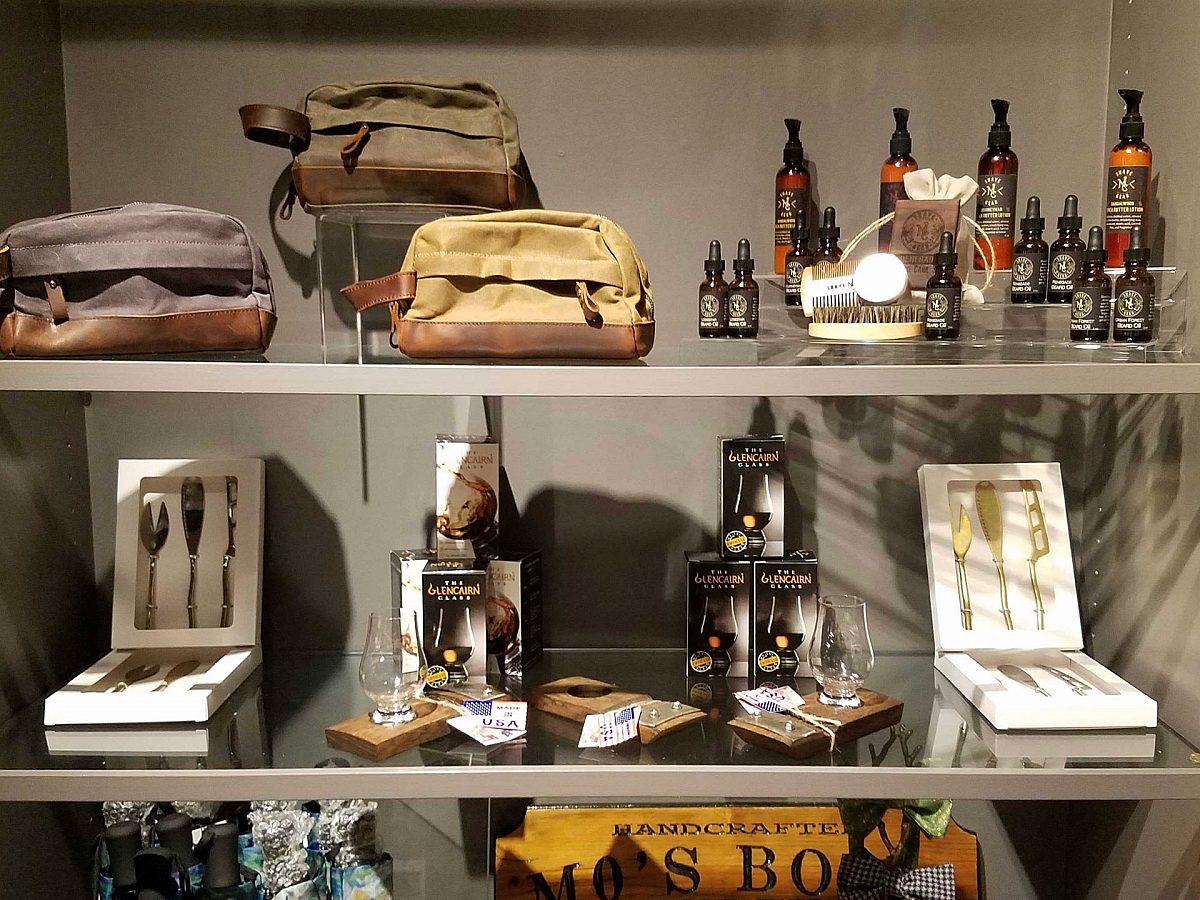 shelves at museum gift shop, lotions, umbrellas, ties, etc.