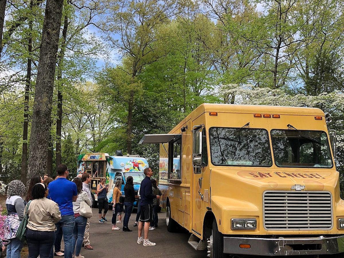 People standing in line at the food trucks