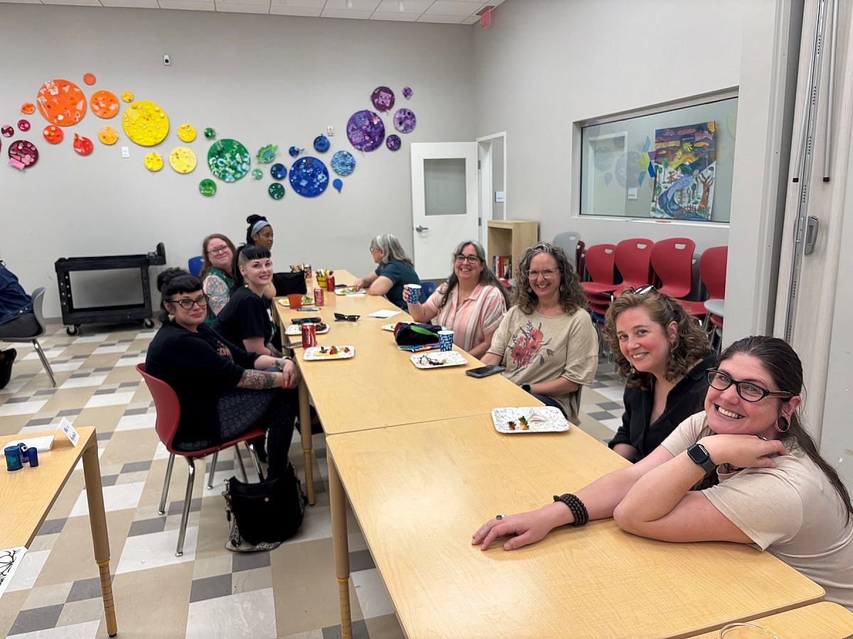 a group of teachers sitting at a table