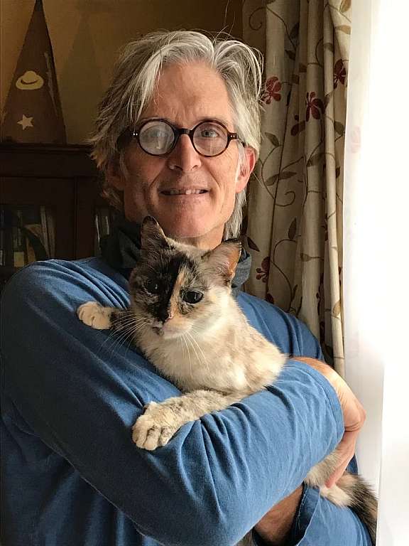 Matthew Lee with close friend, Speckles the cat.
